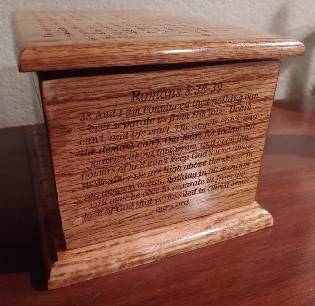 A Laser-Engraved Hardwood Cremation Urn With Intricate Scriptures.