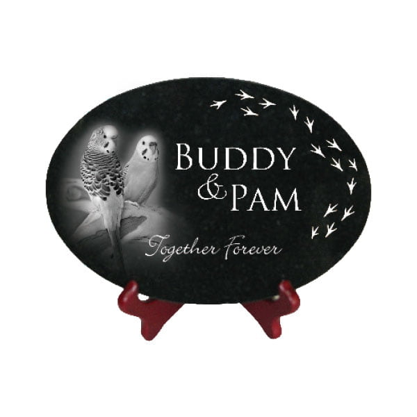 Image Of A Jet Black Granite Oval Tile With An Engraving Of Two Parrots.