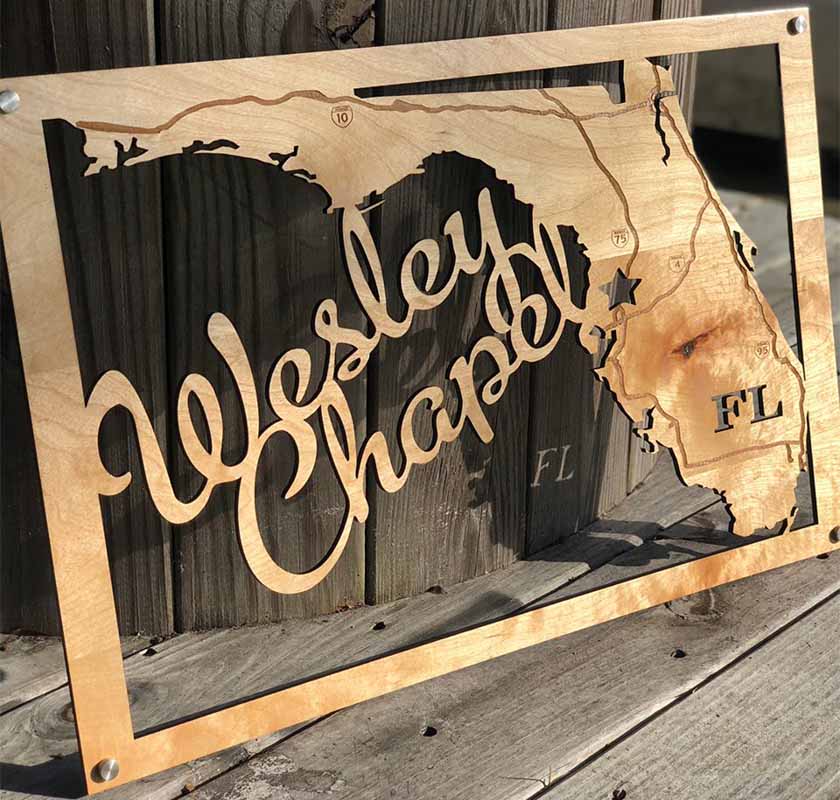 Wooden Sign Laser Cut In Shape Of Florida With Name Of Wedding Couple