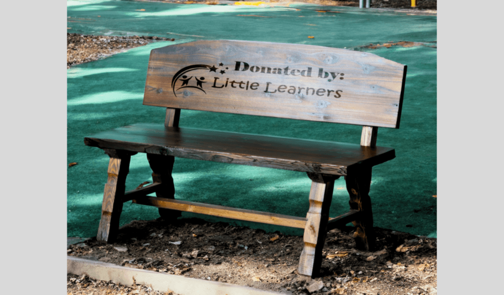 Ap Lazer Engraved A Wooden Bench For Branding And Donation.