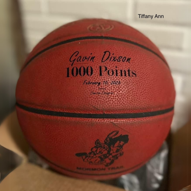 Leather basketball engraved with "Gavin Dixson 1000 Points" using AP Lazer, commemorating a sports achievement.