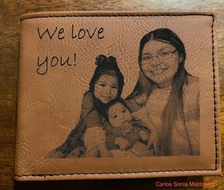 Leather wallet engraved with a family photo and the message "We love you!" using an AP Lazer machine.