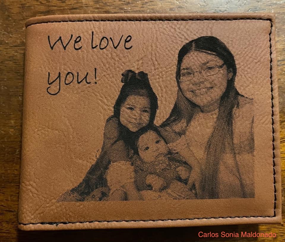 Leather wallet engraved with a family photo and the message