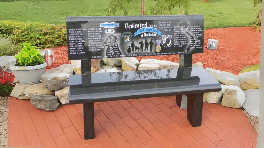 Laser-engraved granite memorial bench dedicated to Vietnam veterans, displayed in a landscaped garden.