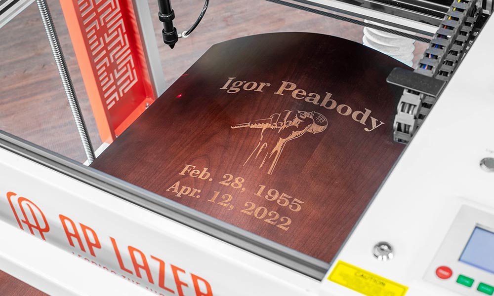 Laser engraving personalized design on a casket