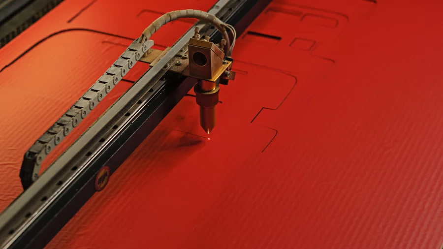 A laser cutting on red acylic.
