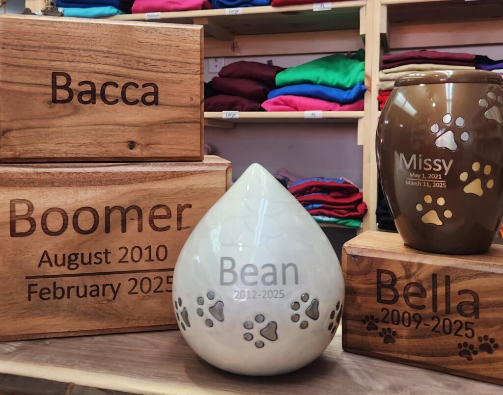 An assortment of laser engraved pet urns.