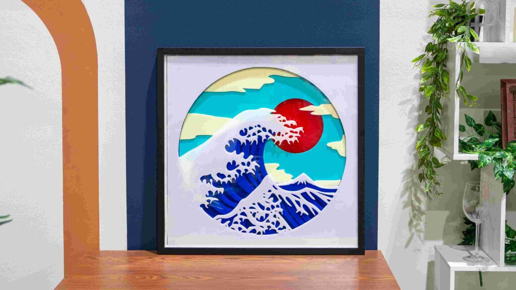 A photo of a laser-cut multi-layered acrylic Great Wave.