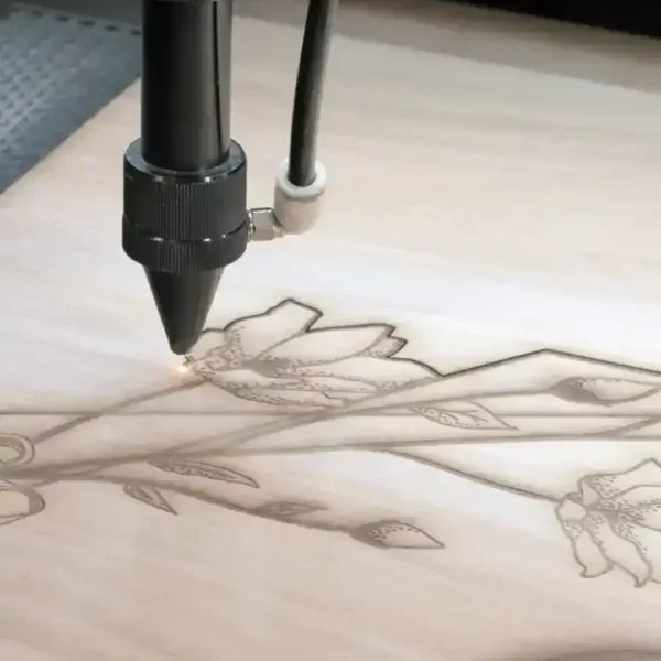 laser engraving floral pattern on wood